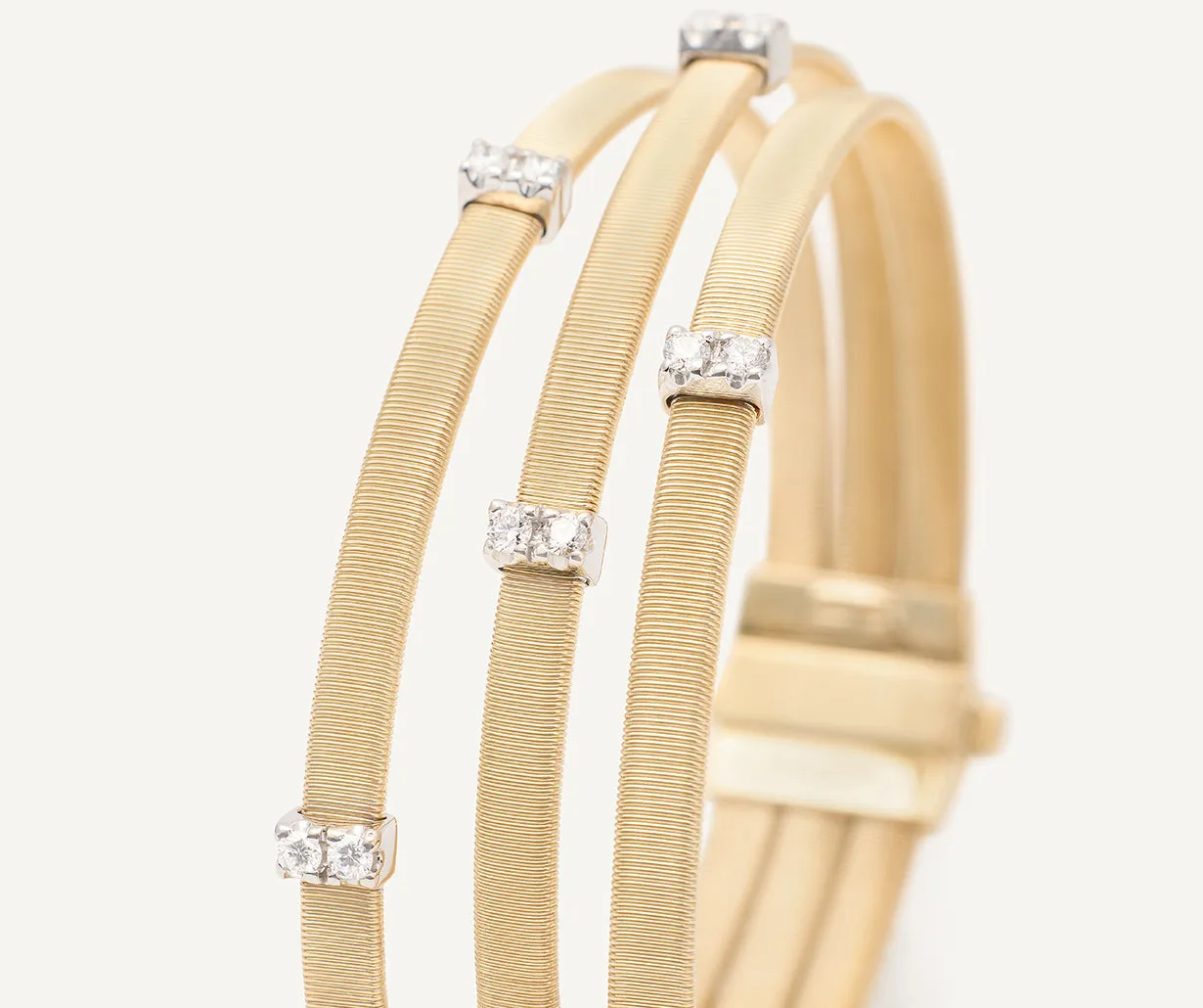 18K Yellow Gold 3-Strand Coil Bracelet With Diamonds Stations